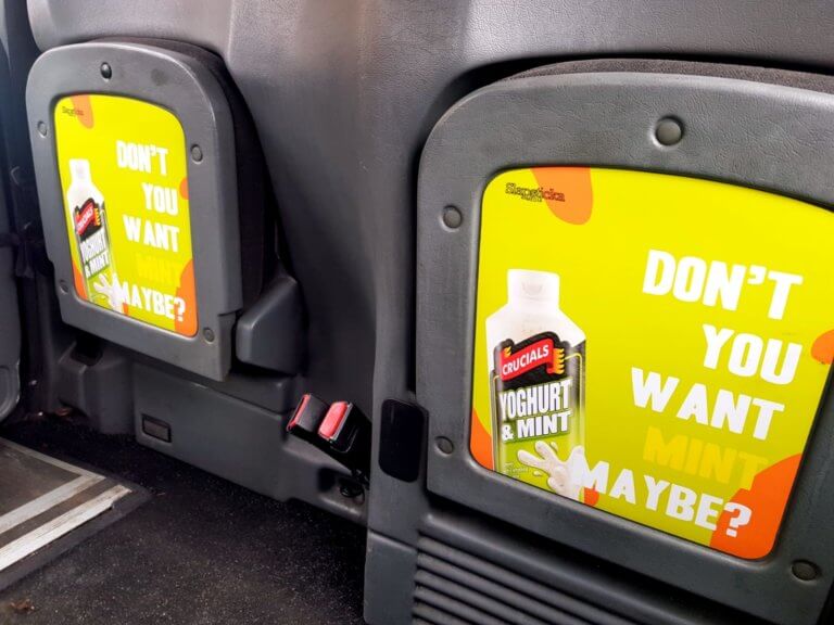 Taxi advertising in Aberdeen cuts to the front.